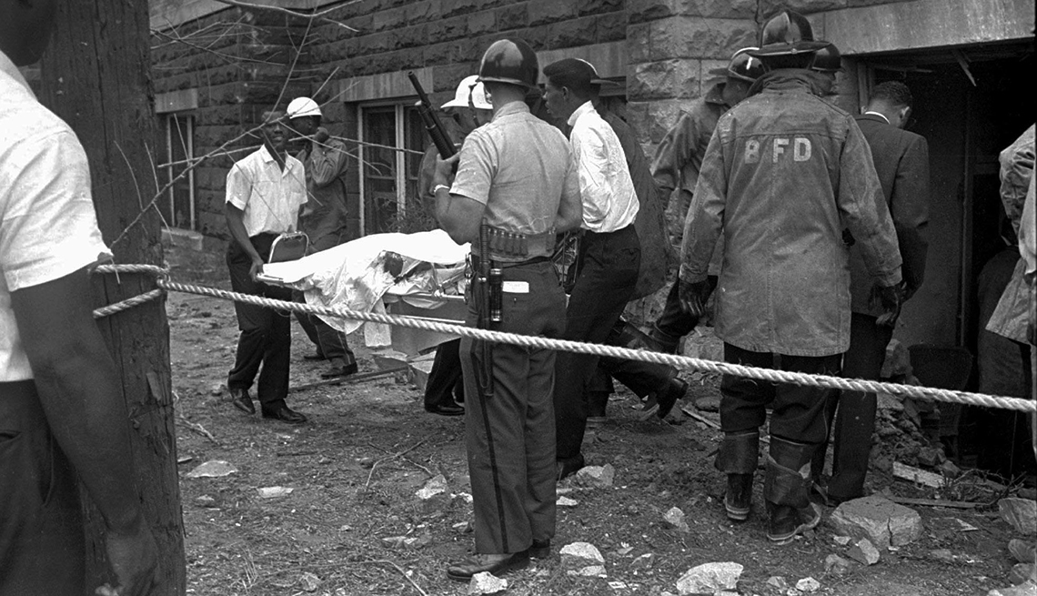 Bodies Are Carried Out Of Burned Building Amongst The Destruction In Birmingham Alabama, Civil Rights Movement, 1963 Was a Year With Lasting Impact, Violence In Birmingham, AARP Politics, Events And History