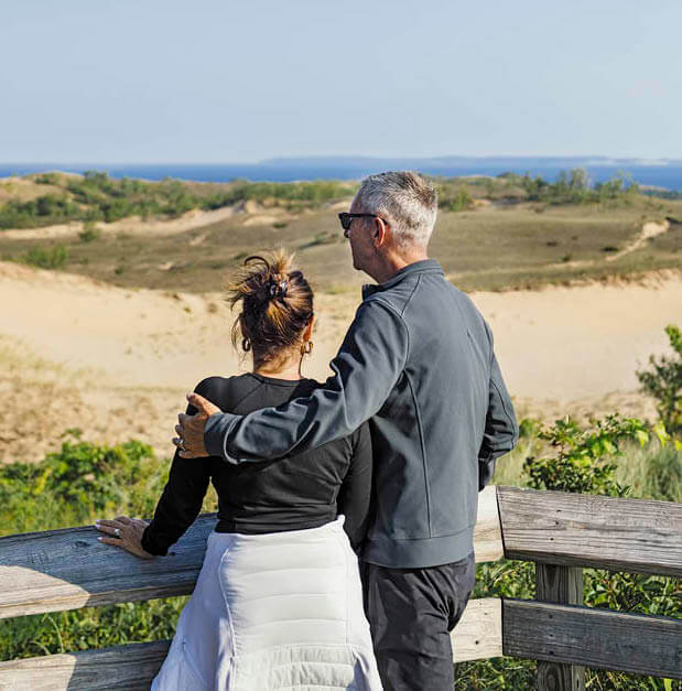 Photo of a couple overlooking Sleeping Bear Dunes National Lakeshore