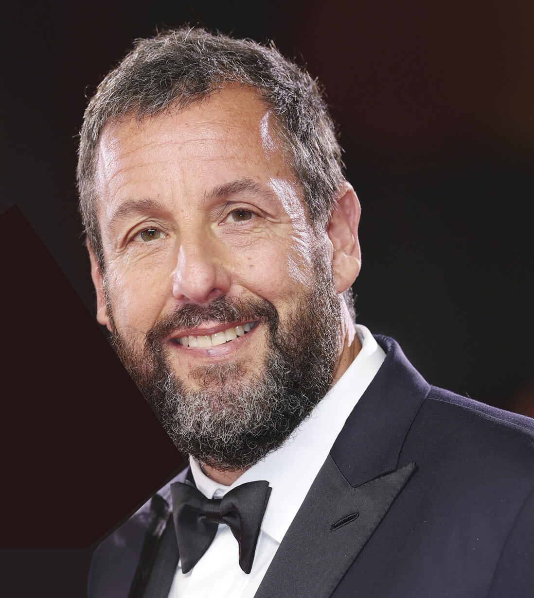 Portrait of Adam Sandler in a black suit 