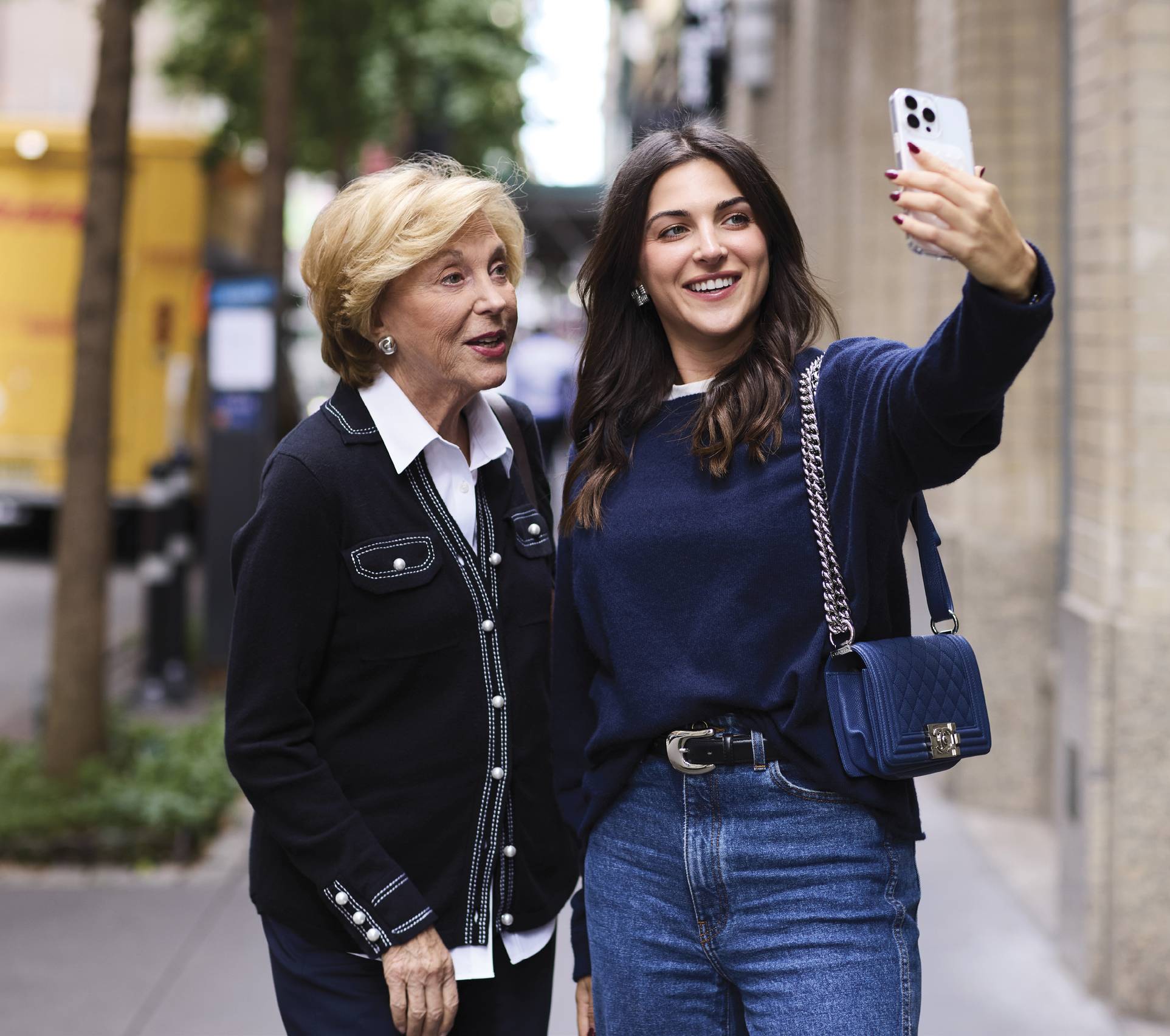 Image of both talking a selfie together on the streets
