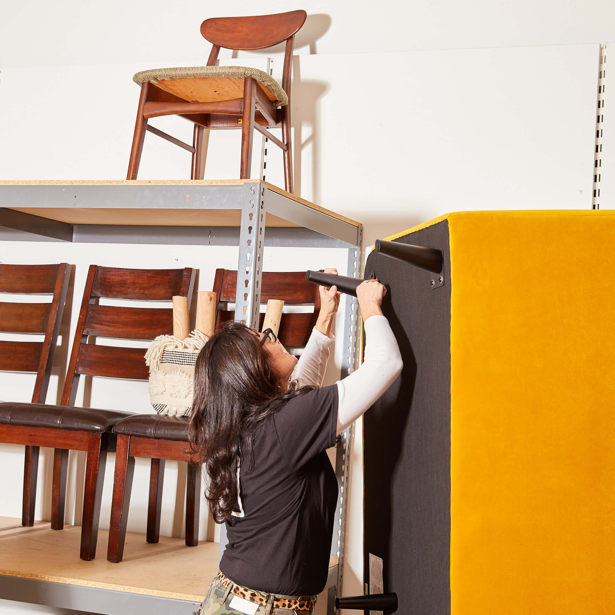 Image of Carolyn Flannery at a non-profit furniture bank she founded.