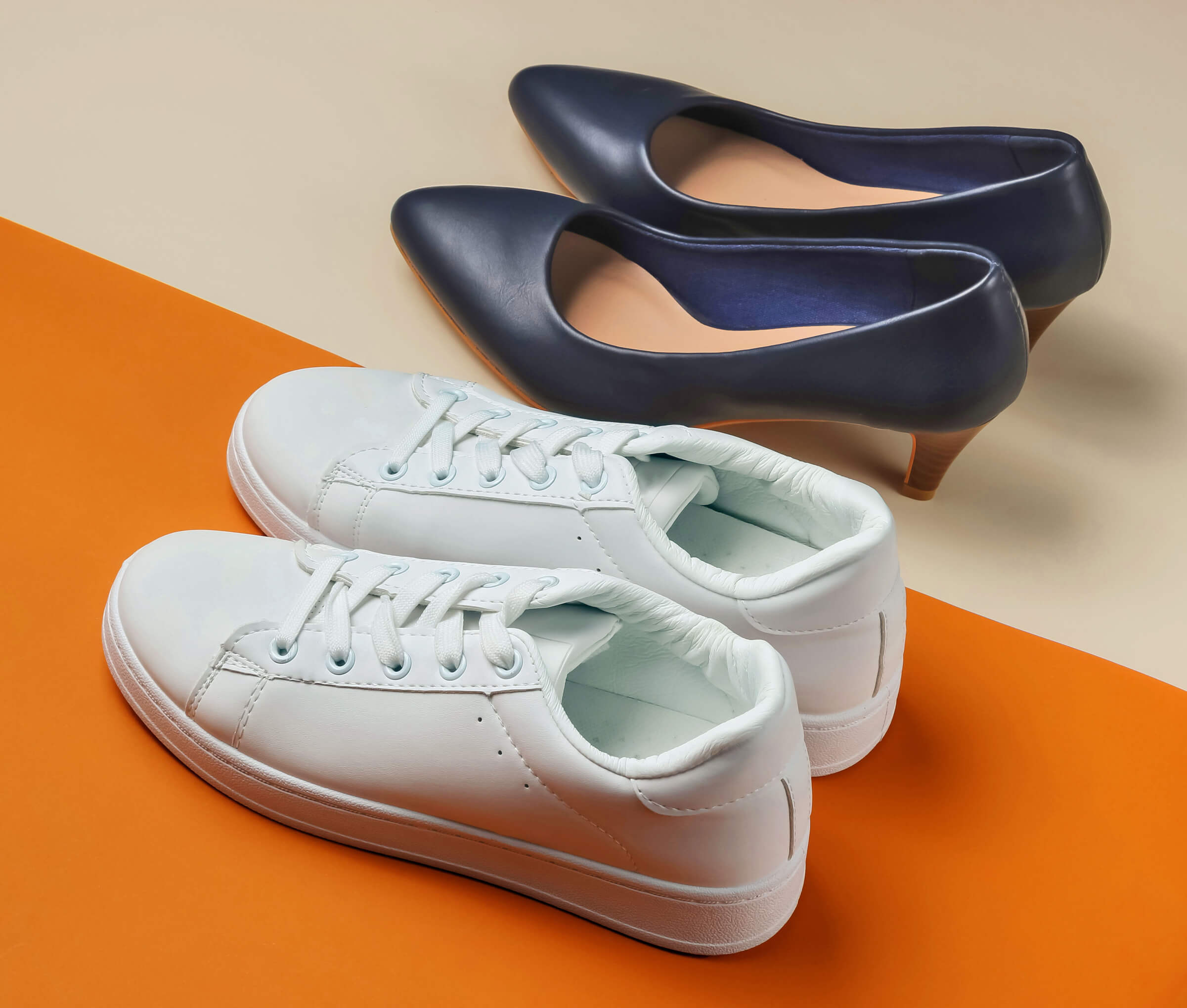 Photo of a pair of sneakers and a pair of heels