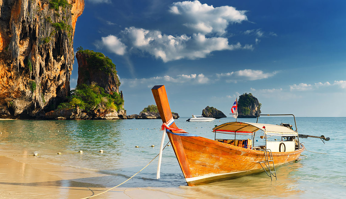 A Boat Moored Near The Beach In Thailand, Best Honeymoon Destinations