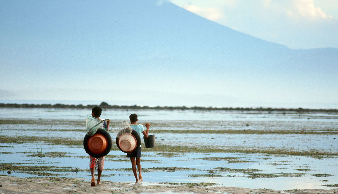 Young Local Boys On The Beach In Bali Indonesia, Best Honeymoon Destinations