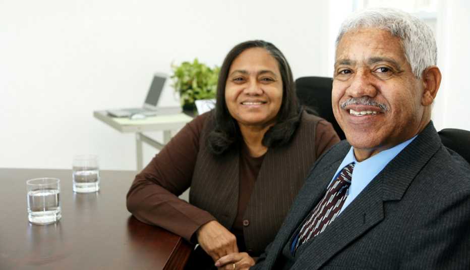 mature Latino man and woman, business meeting, AARP Foundation, Senior Community Service Employment Program