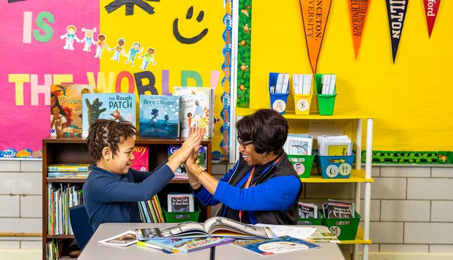 a a r p volunteer tutor elizabeth marie brooks working with a student in an elementary school