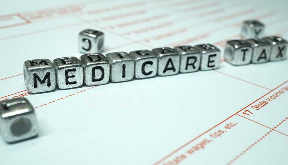 silver blocks that spell out medicare tax