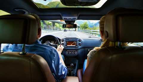 Couple driving in SUV