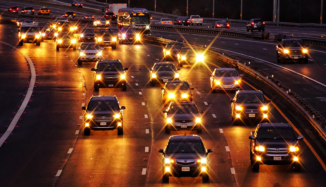 headlights on a highway in arlington in the evening