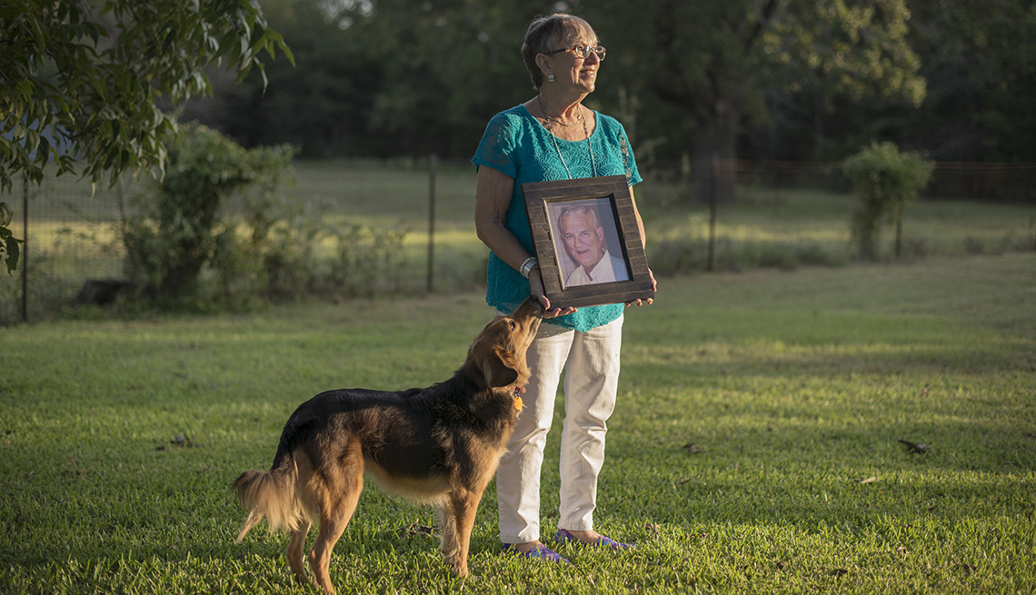 Rita Scott holds a photo of her husband