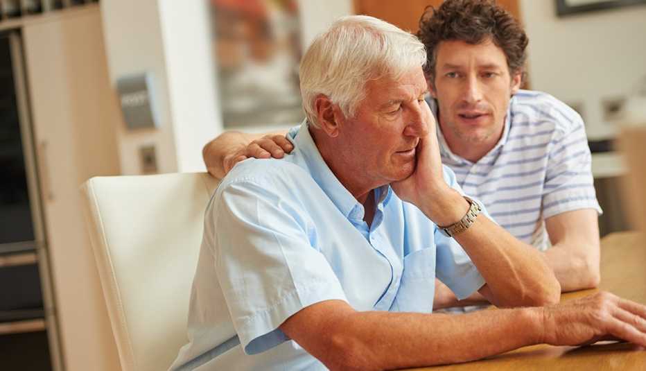Adult son having a serious conversation with his aging father