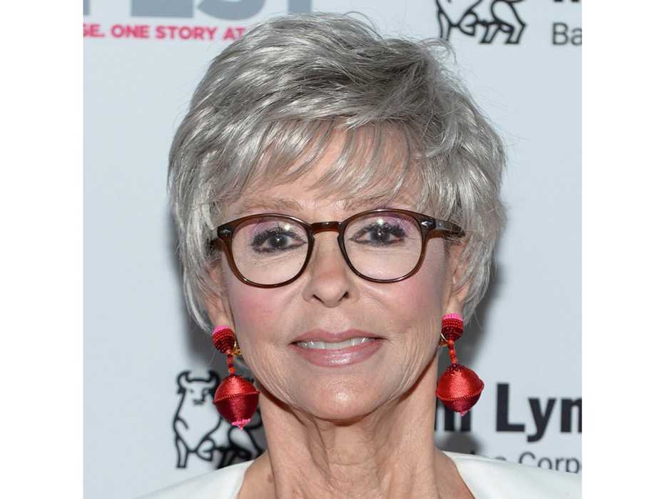 Rita Moreno in large classic tortoiseshell frames.