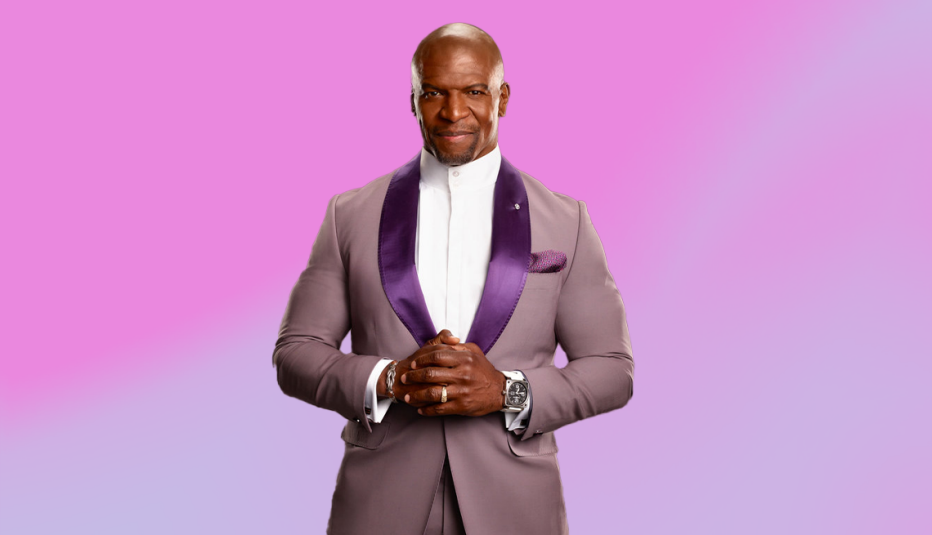 terry crews in tanish suit with purple pocket square, hands clasped together, light purple ombre background