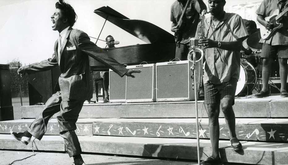 little richard performing on stage with band