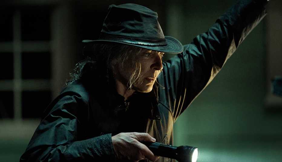 Allison Janney holding a flashlight in the Netflix film Lou