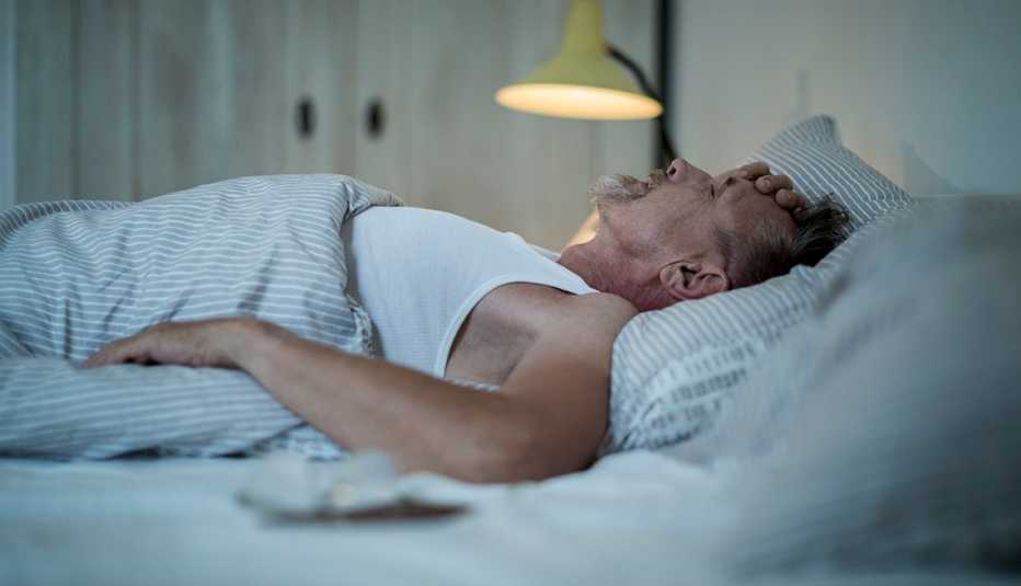 man struggling to sleep