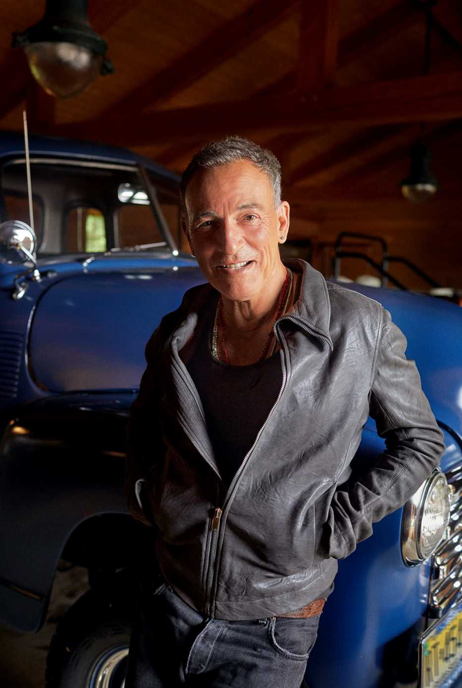 bruce springsteen smiles at the camera