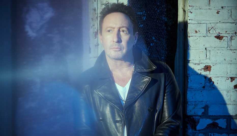 Julian Lennon wearing a leather jacket