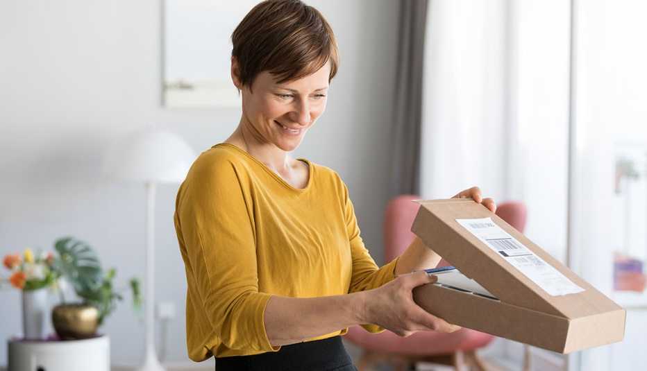 woman looking inside a box