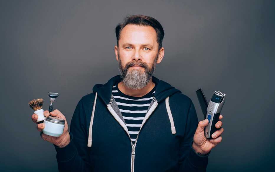 man preparing to trim his beard