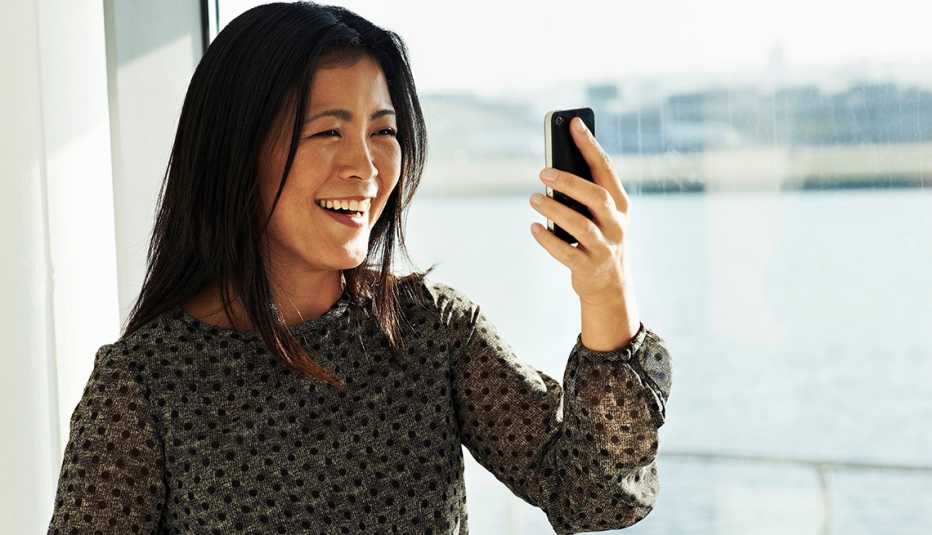 A woman on a video call on her cellphone