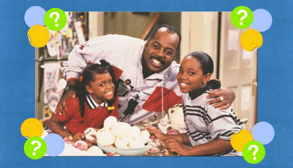 Carl (Reginald VelJohnson) in between Jaimee Foxworth (Judy) and Kellie S. Williams (Laura) surrounded by yellow, blue and green circles with question marks in them