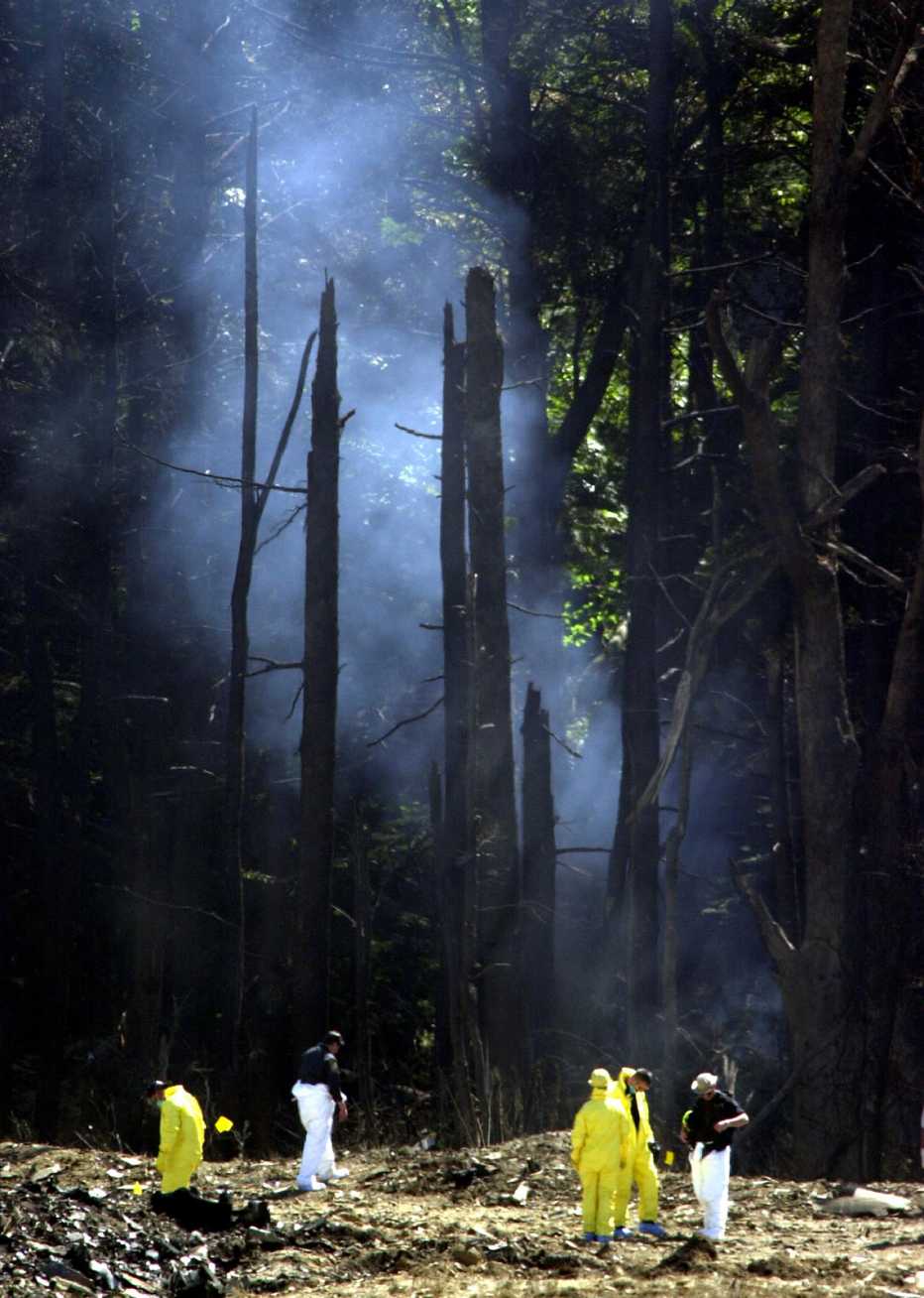 on september twelfth two thousand one smoke rises from the field in shanksville pennsylvania where the last plane crashed
