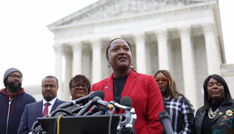 janai nelson speaking to members of the press