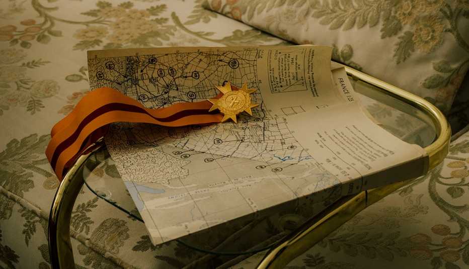 A medal and a map of Omaha Beach