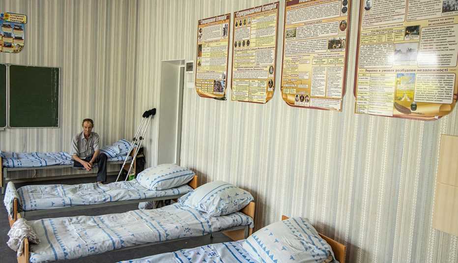A man in one of the converted classrooms. 