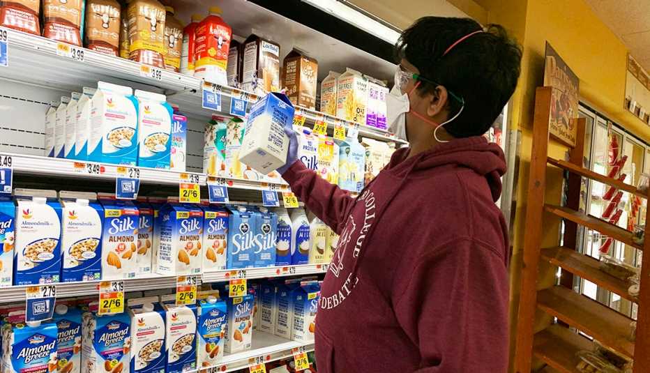 Dhruv buying milk at the grocery store