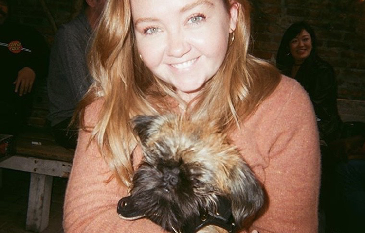 Maggie Connolly holding her pet dog Trudy