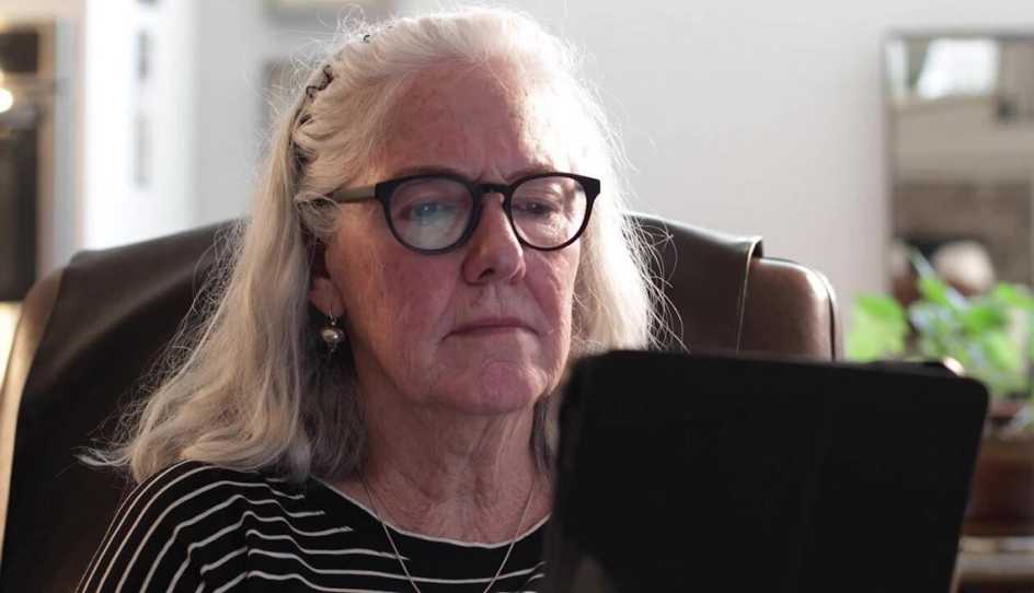 aarp user enjoying games at home on her tablet