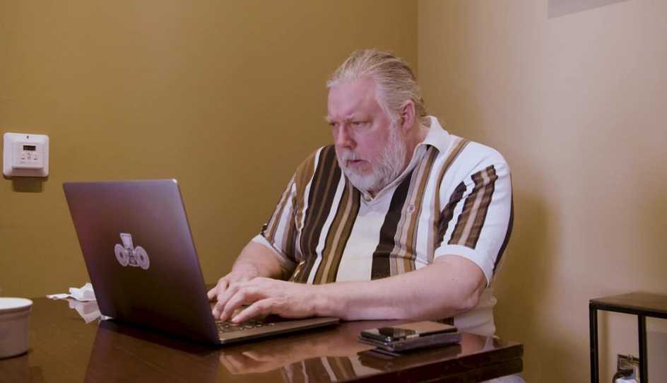 aarp user enjoying games at home on his computer