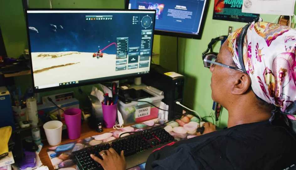 aarp user enjoying games at home on her computer
