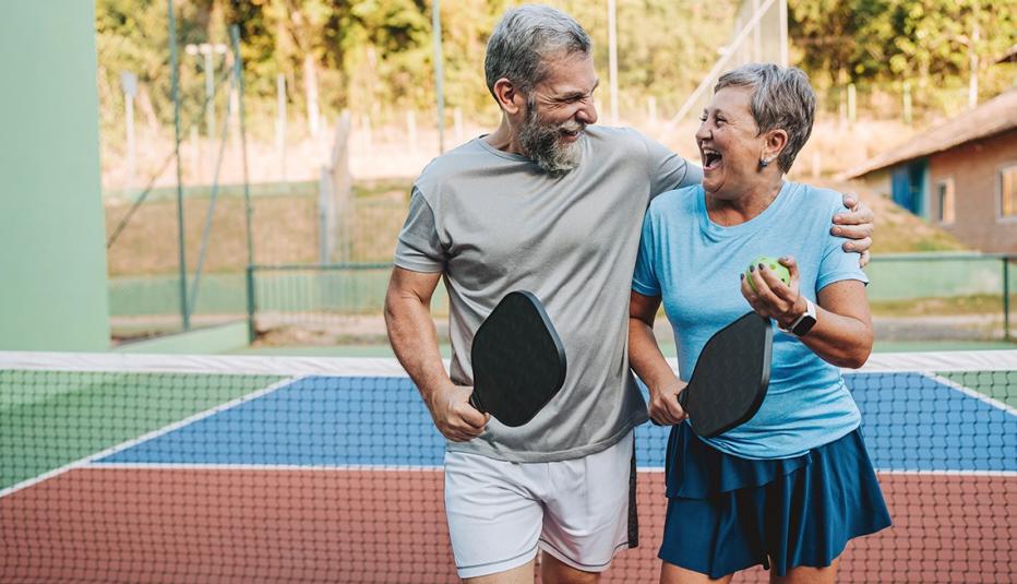 Senior couple playing pickleball