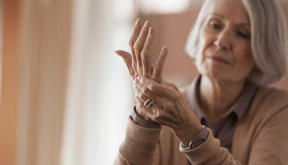 Senior Caucasian woman rubbing her hands
