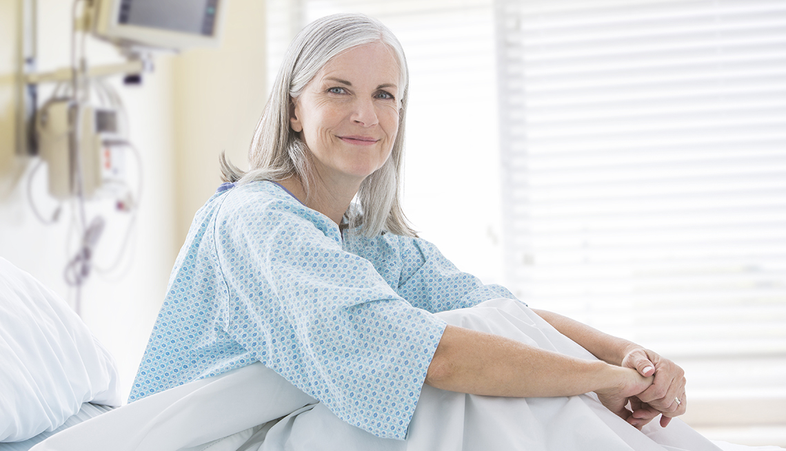 Portrait of smiling Caucasian woman in hospital bed