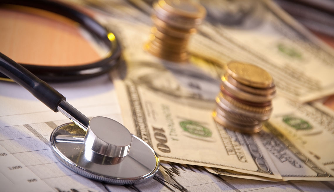 image of money, graphs and stethoscope