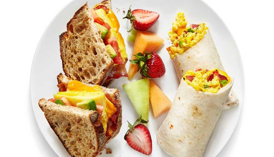 Egg burritos and an egg sandwich on the plate