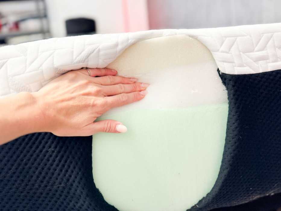 The Nectar Premier Memory Foam’s side is cut open to reveal two dense layers of memory foam