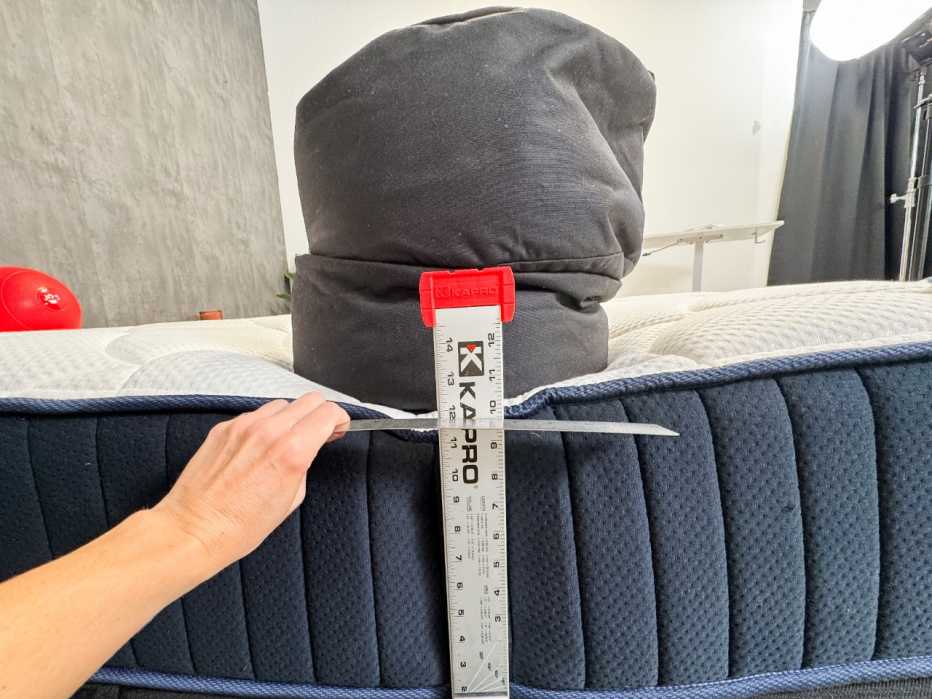 Weighted sandbag on edge of bed