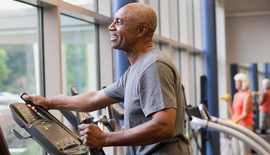 African-American man, elliptical machine, gym, Personal Best: My Fitness