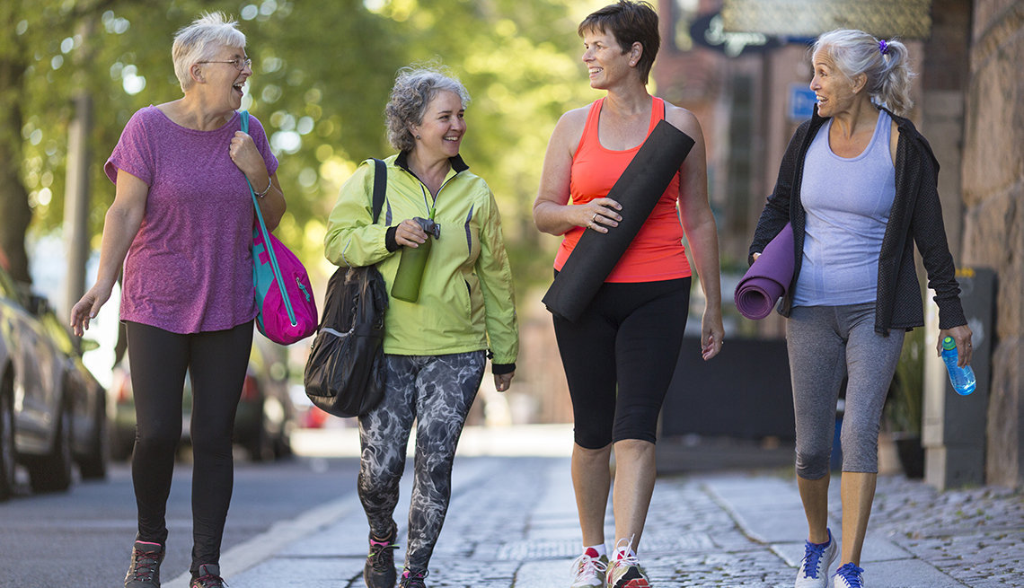 Women walking together on the way to a workout.