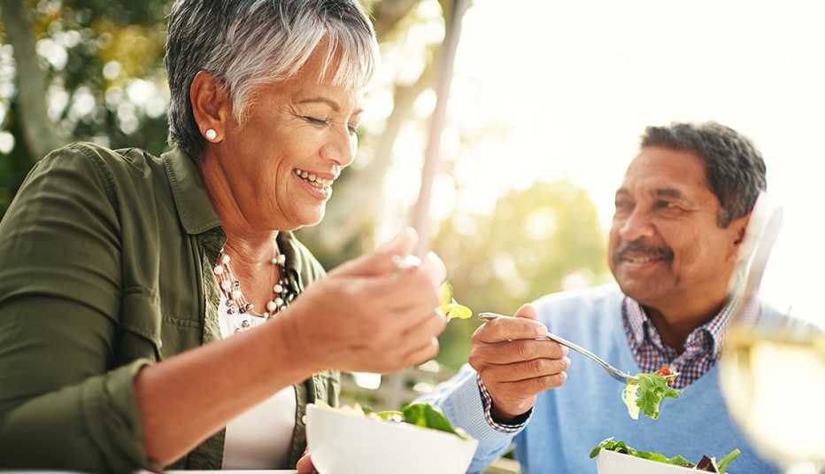 a couple eating salads
