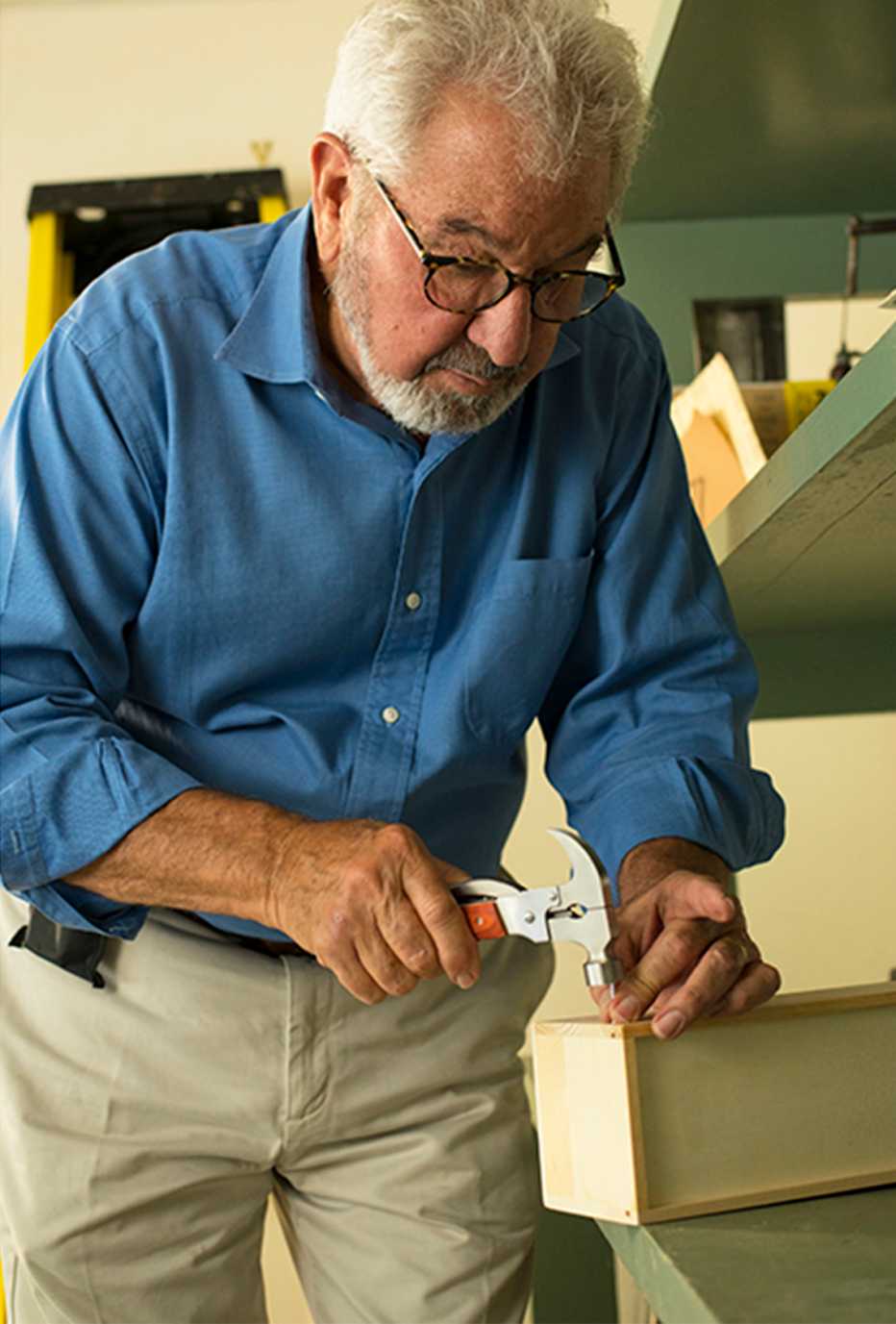 Bob Vila hammering a nail