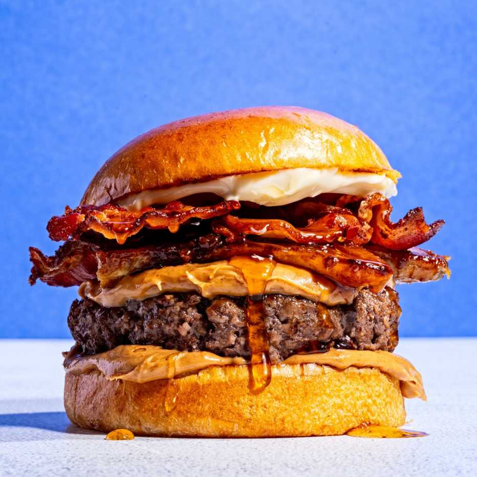 A hamburger with peanut butter, bacon and maple syrup