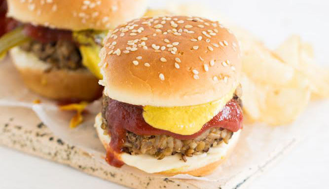 Black Bean and Rice Vegan Burger on a plate with potato chips