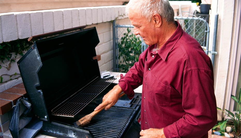 A man cleaning his grill