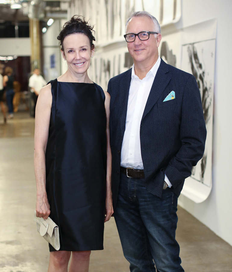 author Tracy Achor Hayes with husband Van dressed up in art gallery